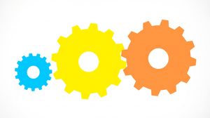 Interlocking cogwheels showing how small actions compound into larger results.