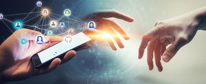 Blog cover depicting the contrast between digital interaction via a smartphone and genuine human hand-to-hand connection.